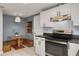 Modern kitchen with a stainless steel range, subway tile backsplash, and built-in dining nook at 305 6Th Sw Ave, Largo, FL 33770