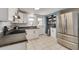 Well-equipped kitchen with stainless steel appliances, white cabinets, and access to an outdoor area at 305 6Th Sw Ave, Largo, FL 33770