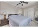 Bright main bedroom with a king-size bed, built-in shelving, and ample closet space at 305 6Th Sw Ave, Largo, FL 33770