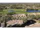 Beautiful aerial view of townhomes with a serene lake and golf course in the background at 3130 Eagles Landing W Cir, Clearwater, FL 33761