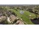 View of homes overlooking lush green golf course and pond at 3130 Eagles Landing W Cir, Clearwater, FL 33761