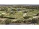 Beautiful aerial view of the golf course and community with mature trees and lush landscaping at 3130 Eagles Landing W Cir, Clearwater, FL 33761