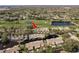 Scenic aerial view of townhomes near a golf course and community ponds at 3130 Eagles Landing W Cir, Clearwater, FL 33761