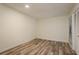 Empty bedroom featuring wood floors, a closet, and natural light at 3130 Eagles Landing W Cir, Clearwater, FL 33761