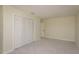 Neutral bedroom with a closet, plush carpeting, and a view into the hallway at 3130 Eagles Landing W Cir, Clearwater, FL 33761