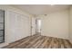 Bedroom with hardwood floors and closet with folding doors at 3130 Eagles Landing W Cir, Clearwater, FL 33761