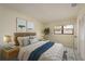 Bright bedroom with soft, neutral colors, a large window and a cozy, inviting feel at 3130 Eagles Landing W Cir, Clearwater, FL 33761
