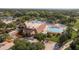 Community clubhouse and pools surrounded by mature trees and ample parking at 3130 Eagles Landing W Cir, Clearwater, FL 33761