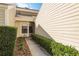 Welcoming front entrance with lush green hedges and a well-maintained walkway at 3130 Eagles Landing W Cir, Clearwater, FL 33761
