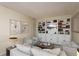 Bright living room with built-in shelving, modern decor, and comfortable seating at 3130 Eagles Landing W Cir, Clearwater, FL 33761