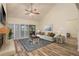 Bright living room featuring vaulted ceiling, fireplace, sliding doors, and elegant decor at 3130 Eagles Landing W Cir, Clearwater, FL 33761