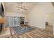 Inviting living room with vaulted ceilings, a fireplace and serene views from the sliding glass doors at 3130 Eagles Landing W Cir, Clearwater, FL 33761