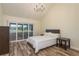 Main bedroom with a chandelier, vaulted ceiling and a large window with views of the outdoors at 3130 Eagles Landing W Cir, Clearwater, FL 33761