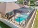 Aerial shot of a screened-in pool and patio in the backyard of a single-Gathering home at 32484 Worden Pass, Wesley Chapel, FL 33543