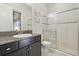 Bathroom features a single sink, vanity and a modern glass-enclosed shower at 32484 Worden Pass, Wesley Chapel, FL 33543