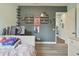 A colorful bedroom includes a gray bed and desk with computer monitor at 32484 Worden Pass, Wesley Chapel, FL 33543