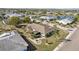 Well maintained roof on a home with a screened patio and lush landscaping at 335 Stroll Ln, Sun City Center, FL 33573