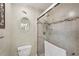 Updated bathroom featuring tiled walls, a glass-enclosed shower, and a modern toilet at 335 Stroll Ln, Sun City Center, FL 33573
