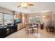 Bright dining area featuring tile floors, a chandelier, and plenty of natural light from the windows at 335 Stroll Ln, Sun City Center, FL 33573