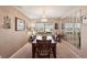 Traditional dining room featuring a chandelier, large table, and mirror wall decor at 335 Stroll Ln, Sun City Center, FL 33573