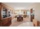 Inviting dining room features a chandelier, ample natural light, and custom cabinetry at 335 Stroll Ln, Sun City Center, FL 33573