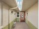 Inviting entryway with a decorative glass door, sidelight window, and overhead lighting at 335 Stroll Ln, Sun City Center, FL 33573