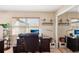 Office with desk, leather chair, shelving and window with blinds at 335 Stroll Ln, Sun City Center, FL 33573
