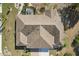 Birds eye view of the home's roof with manicured landscaping below at 335 Stroll Ln, Sun City Center, FL 33573