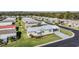 Aerial view of a well-maintained neighborhood with lush green lawns and neatly arranged homes at 37508 Gill Ave, Zephyrhills, FL 33541