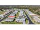 Aerial view of the neighborhood with lush trees and well-maintained landscaping at 37508 Gill Ave, Zephyrhills, FL 33541