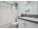 Cozy bathroom with a shower-tub combo, white vanity, and tiled backsplash at 37508 Gill Ave, Zephyrhills, FL 33541