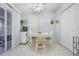 Bright Dining Area featuring tile floors, plentiful natural light, and seating for four at 37508 Gill Ave, Zephyrhills, FL 33541