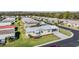 Well-manicured home featuring new metal roof, covered carport, and manicured shrubbery at 37508 Gill Ave, Zephyrhills, FL 33541
