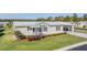 Charming home with a well-maintained lawn, updated metal roof and inviting carport at 37508 Gill Ave, Zephyrhills, FL 33541