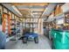 Spacious garage with ceiling fan, work bench, storage shelving, and included golf cart at 37508 Gill Ave, Zephyrhills, FL 33541