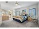 Cozy bedroom featuring plush carpet, white trim, and bright natural light at 37508 Gill Ave, Zephyrhills, FL 33541