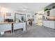 Bright office and kitchen area featuring white cabinets, modern appliances, and ample counter space at 37508 Gill Ave, Zephyrhills, FL 33541