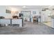 Bright office and kitchen area featuring white cabinets, modern appliances, and ample counter space at 37508 Gill Ave, Zephyrhills, FL 33541