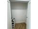 Bright walk-in closet features herringbone wood flooring and white storage cube at 400 Island Way # 612, Clearwater Beach, FL 33767