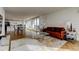 Open-concept living room with hardwood floors, modern furniture, and floor-to-ceiling windows, connecting to dining and kitchen at 400 Island Way # 612, Clearwater Beach, FL 33767