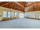Large meeting room with vaulted wood ceilings, large windows and seating, perfect for gatherings at 400 Island Way # 612, Clearwater Beach, FL 33767