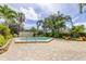 Relaxing hot tub surrounded by tropical landscaping and a paver deck at 400 Island Way # 612, Clearwater Beach, FL 33767