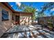 Backyard patio with stone pavers and wooden gate at 411 Kentucky Ave, Crystal Beach, FL 34681