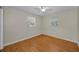 Bedroom with ceiling fan and two windows providing plenty of natural light at 411 Kentucky Ave, Crystal Beach, FL 34681