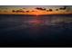 Beautiful sunset over the water, creating a serene and picturesque view at 411 Kentucky Ave, Crystal Beach, FL 34681