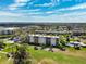 Community aerial shot highlighting building, community pool and tennis at 4240 Ironwood Cir # 404, Bradenton, FL 34209