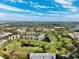 Breathtaking aerial view of the property among a verdant golf course landscape at 4240 Ironwood Cir # 404, Bradenton, FL 34209
