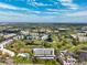 Aerial view of community, highlighting building, golf course, and pool amenities at 4240 Ironwood Cir # 404, Bradenton, FL 34209