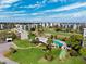 Aerial view displaying clubhouse, pool, golf course, and manicured landscaping at 4240 Ironwood Cir # 404, Bradenton, FL 34209