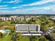 Aerial view showcasing the building, its carport, and lush surroundings at 4240 Ironwood Cir # 404, Bradenton, FL 34209